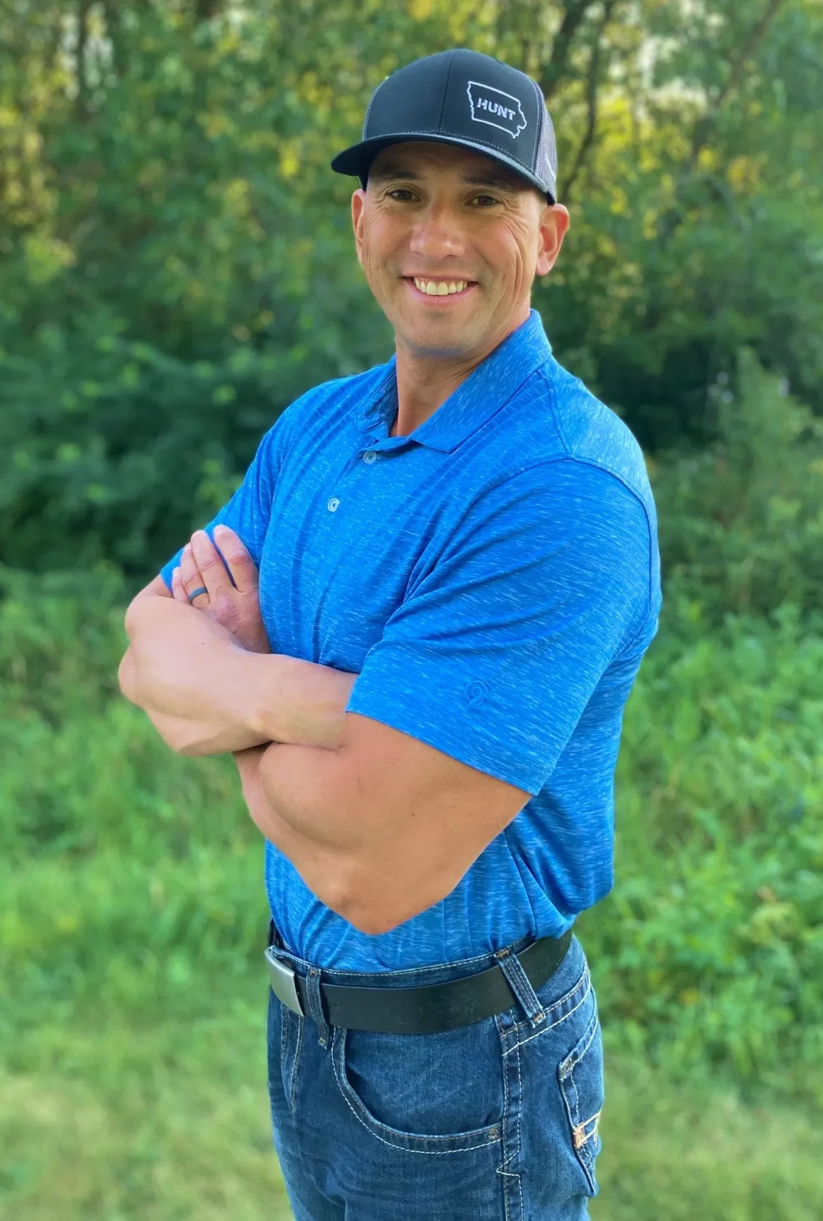 Smiling man wearing a black cap