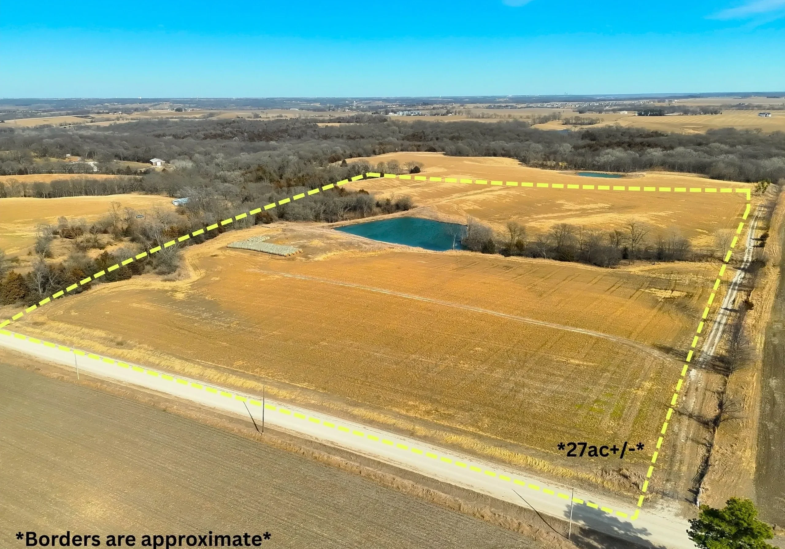Aerial view of farmland with pond